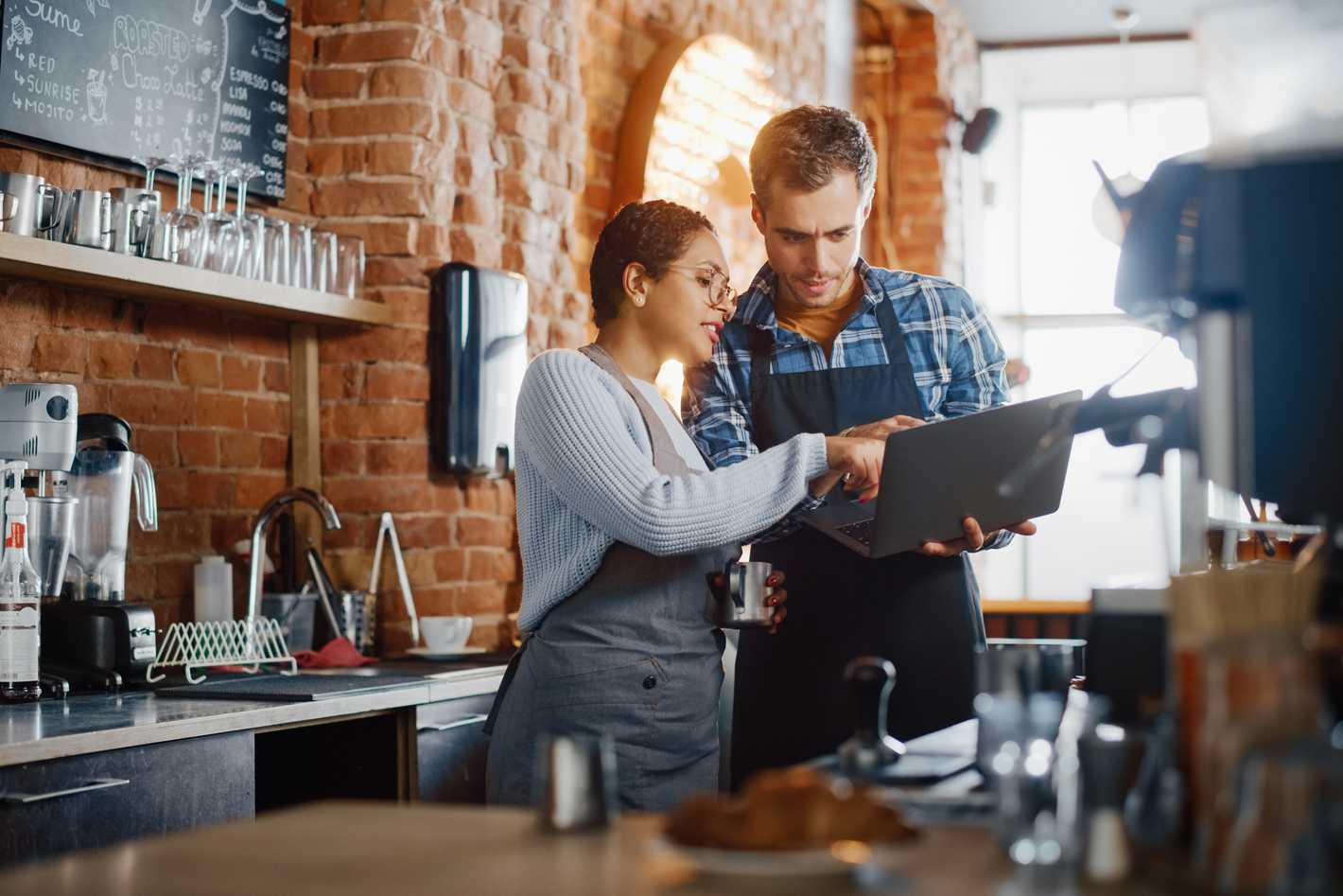 Business owners looking at a laptop
