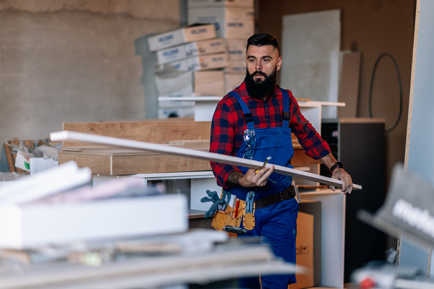 man working in garage with lumber
